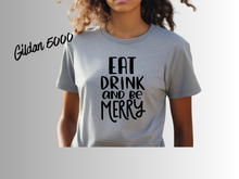 Load image into Gallery viewer, Eat Drink and Be Merry Christmas Shirt, White Holiday T-Shirt, Christmas Party Tee, Festive Xmas Shirt, Holiday Graphic Tee, Christmas Gift