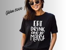 Load image into Gallery viewer, Eat Drink and Be Merry Christmas Shirt, White Holiday T-Shirt, Christmas Party Tee, Festive Xmas Shirt, Holiday Graphic Tee, Christmas Gift
